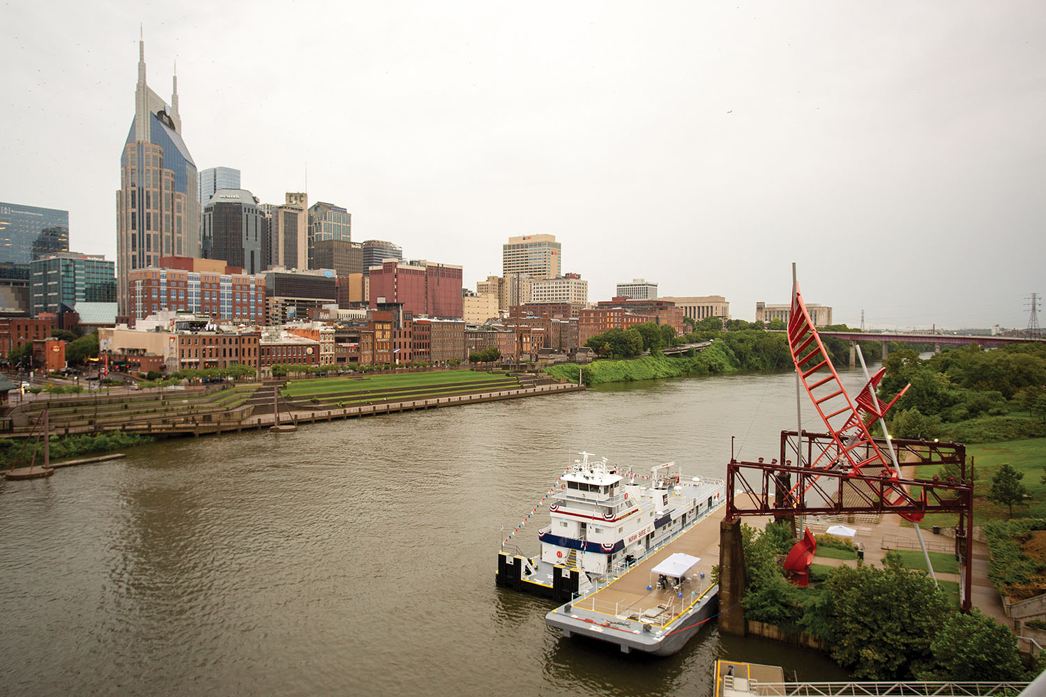 The Youngsuk Chi with the Nashville skyline in the background. (Photo courtesy of Ingram Barge Company)