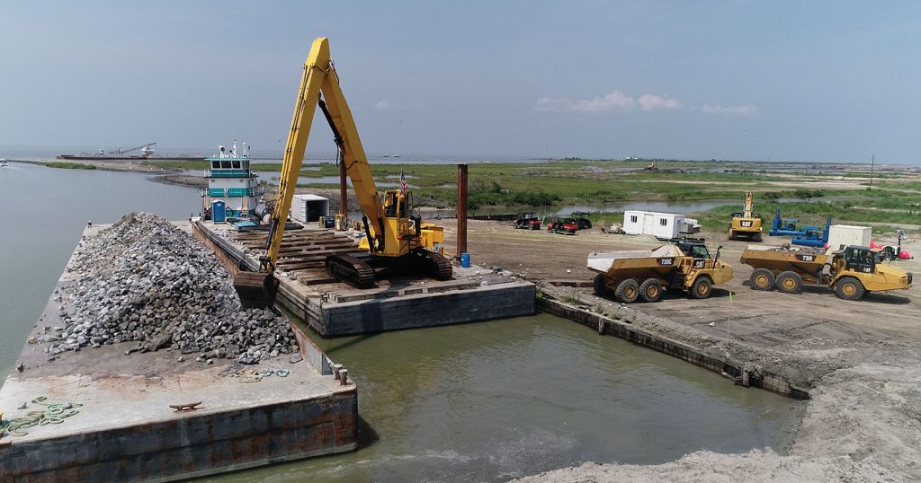 Weeks Marine is the primary contractor on the project with Madere & Sons Towing/Deep South Construction and Salvage subcontracting an armor stone wall and Daulton Barge Leasing, Sales & Management providing 15 deck barges to haul the stone. (Photo courtesy of Daulton Barge Leasing, Sales & Management)