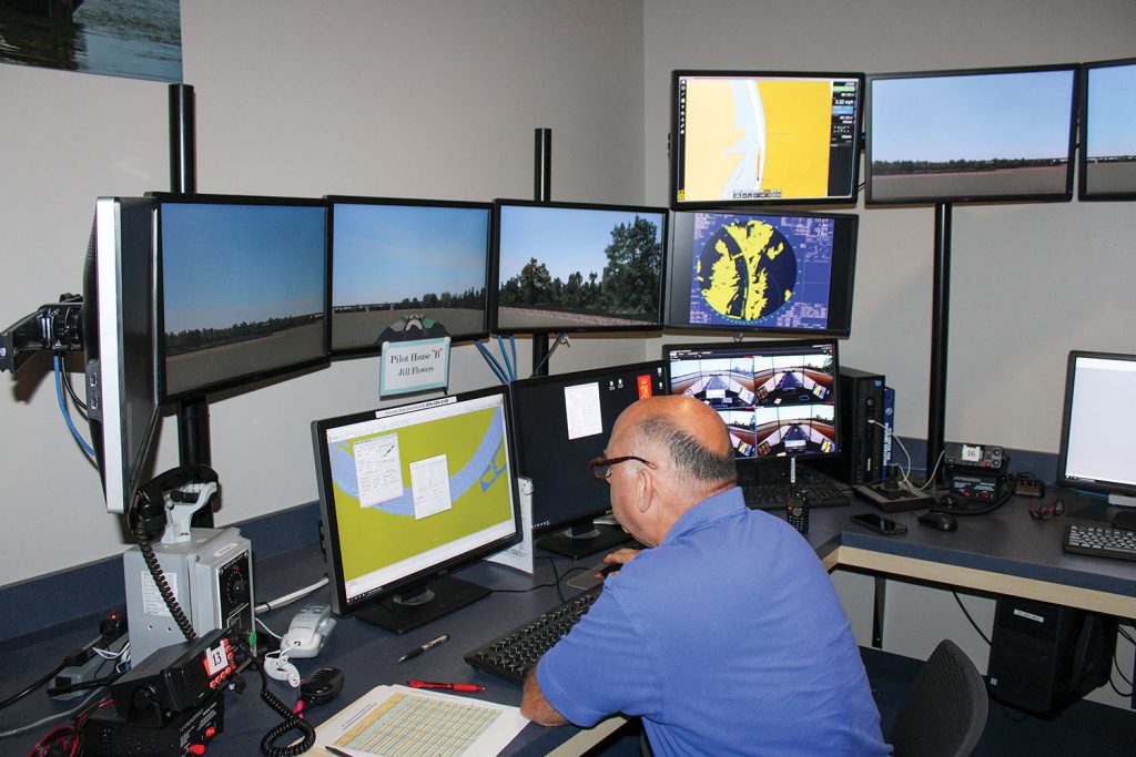 John Arenstam, assistant director for the Seamen’s Church Institute’s Center for Maritime Education in Paducah, Ky., sets up a simulation for participants. (Photo by Shelley Byrne)