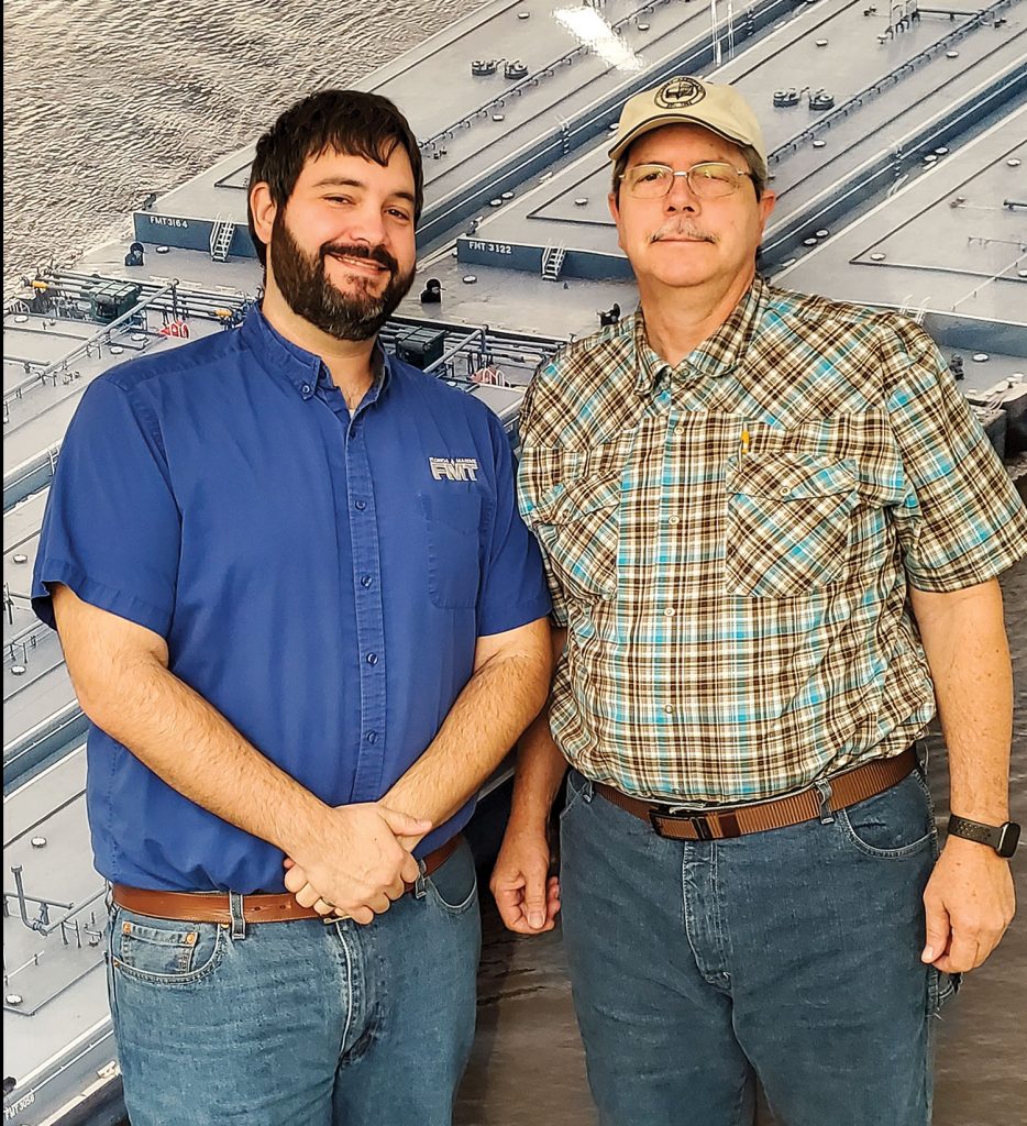 Eric Brumfield, left, and his father, Jeff, at the FMT office.