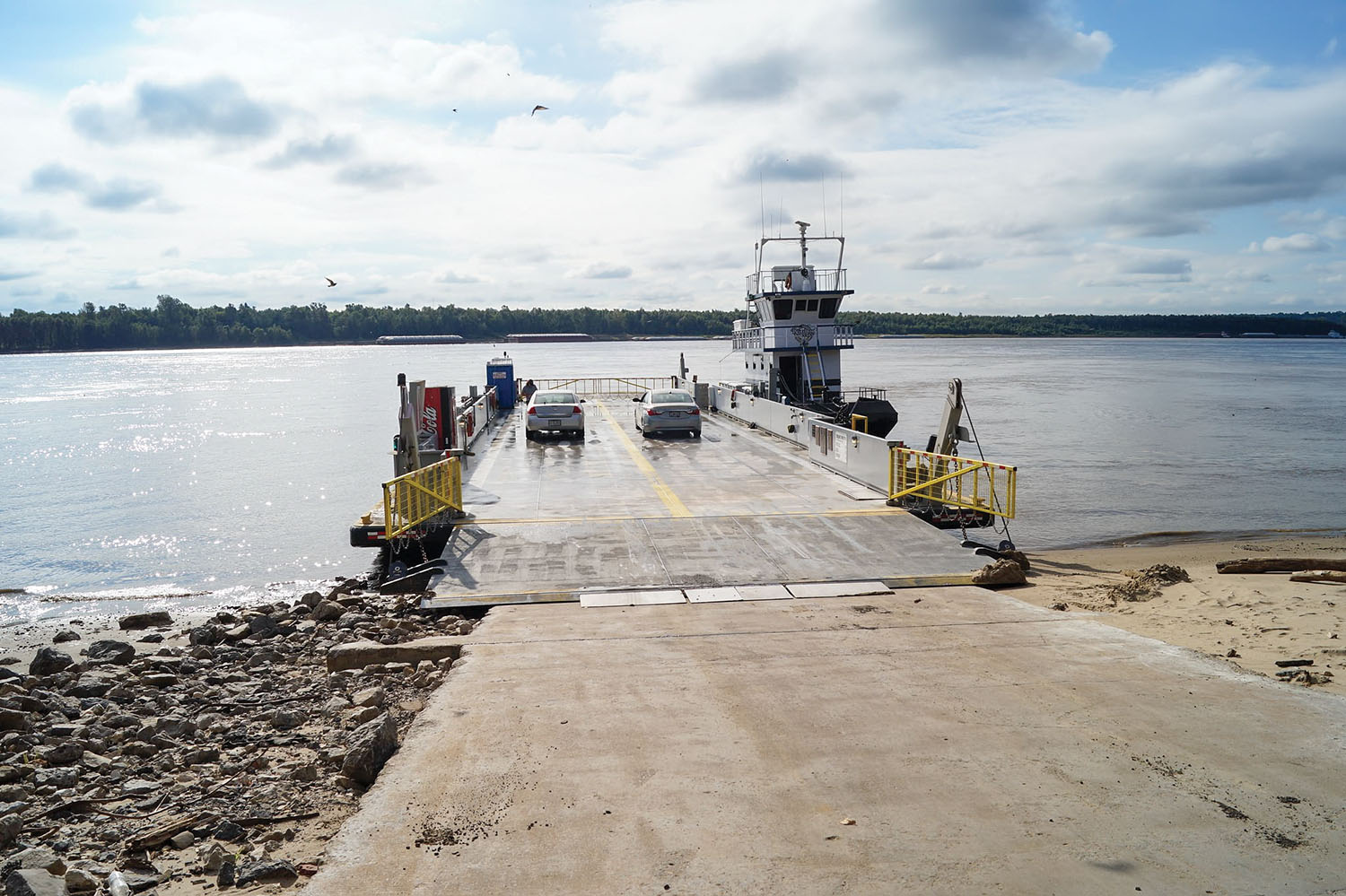 Vehicles load onto the Dorena-Hickman Ferry to cross the Mississippi River between Hickman, Ky., and Dorena, Mo. The ferry is back in service after a week’s closure because of difficulty obtaining the necessary parts for repairs. (Photo courtesy of the Kentucky Transportation Cabinet)