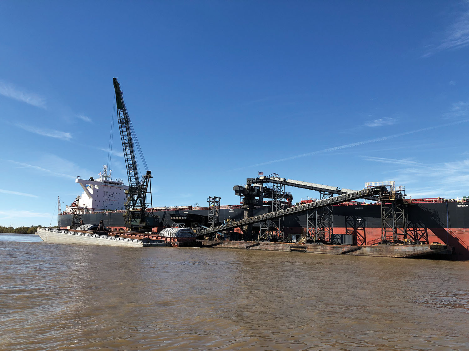 Dos Santos International is providing its Sandwich high-angle conveyor system as part of the conversion of a floating terminal for carbon products into one for grain in New Orleans. The system is designed to use two facing conveyor belts to “hug” the grains while lifting them without spillage or damage. (Photo courtesy of Dos Santos International)