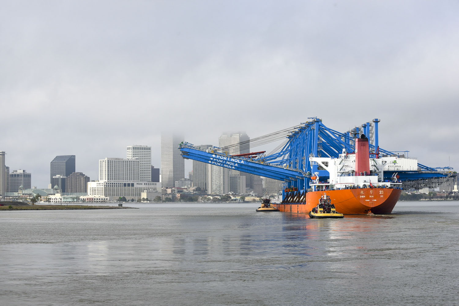New cranes transiting the Mississippi River December 10 as they traveled to the Napoleon Ave. Container Terminal.