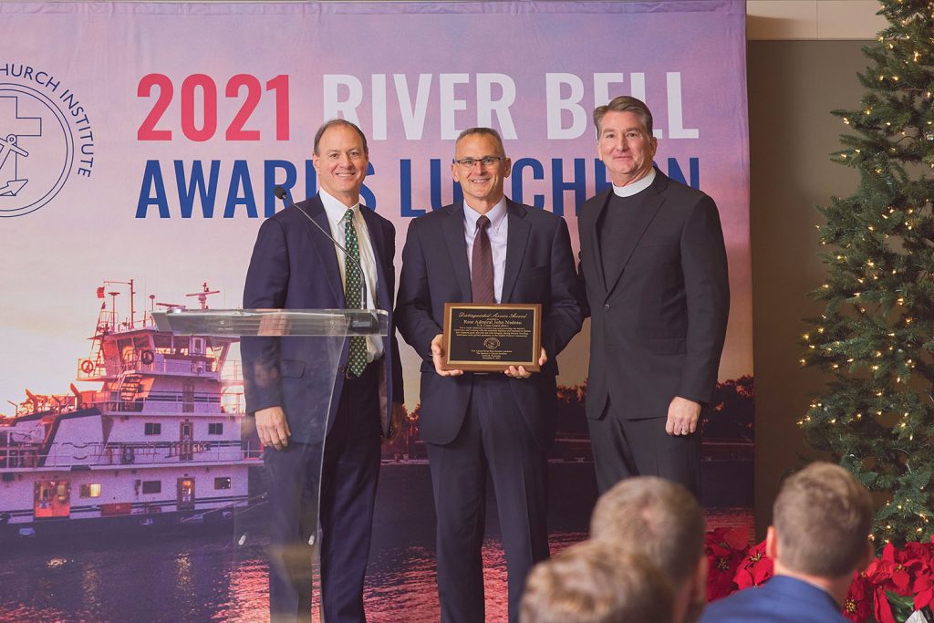 Goast Guard Rear Adm. (Ret.) John Nadeau, center, was presented the Distinguished ServiceAward by Merritt Lane and Rev. Mark Nestlehutt. (Photo courtesy of Seamen's Church Institute)