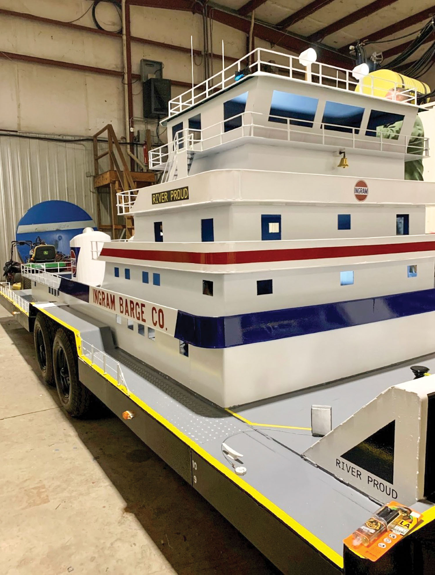Ingram Barge Line employees did the metalwork for the 22-foot towboat float, which is mounted on a trailer, at their Columbus, Ky. facility. They added artificial snow and smoke coming from the stacks this year. (photo courtesy of Ingram Barge Company)