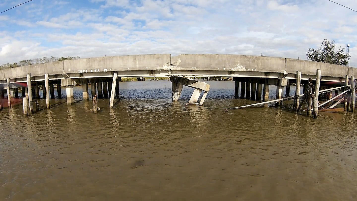 The Coast Guard and National Transportation Safety Board marine casualty investigators are investigating a December 23 barge allision with the Bayou Ramos Bridge near Morgan City and Amelia, Louisiana, on Highway 182. (Courtesy of Cajun Drone Photography, Jim Pierce JR FAA 107 Certified Pilot)