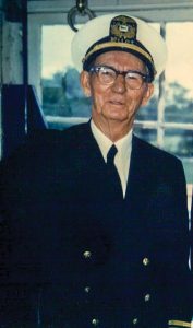 Capt. Harris D. Underwood in Belle of Louisville pilothouse, 1971. (Photo by Keith Norrington)