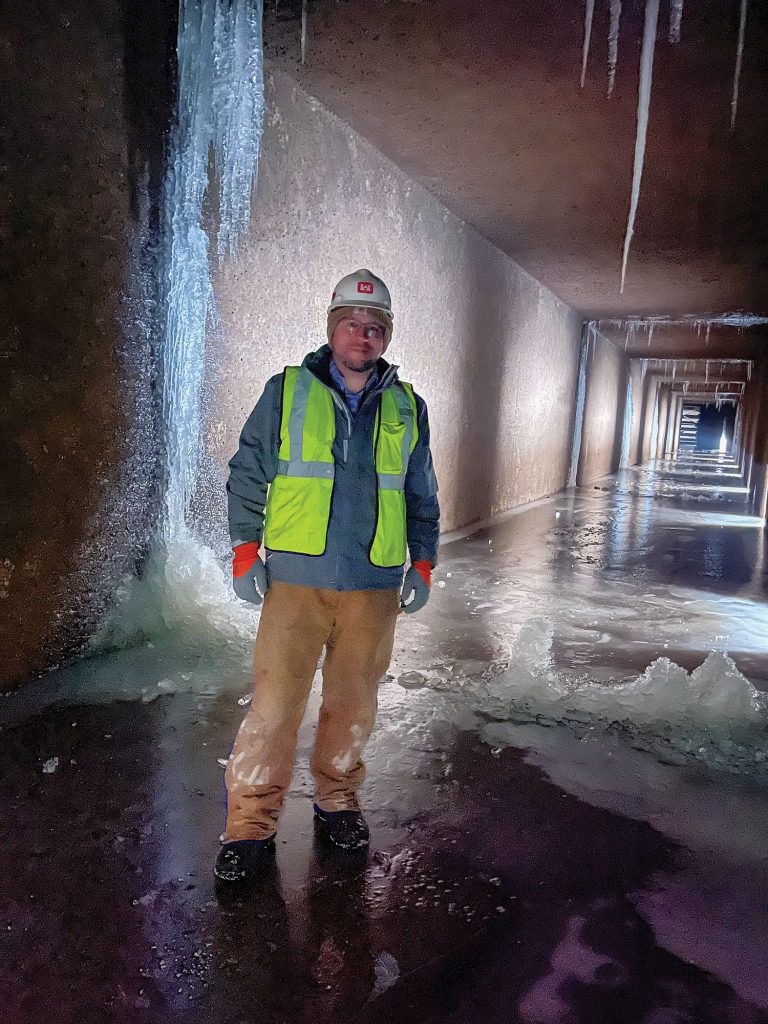 Andrew Goodall, senior program manager for the Rock Island Engineer District, stands in a filling/emptying culvert at Upper Mississippi River Lock 15. (Photo by Paul Rohde)