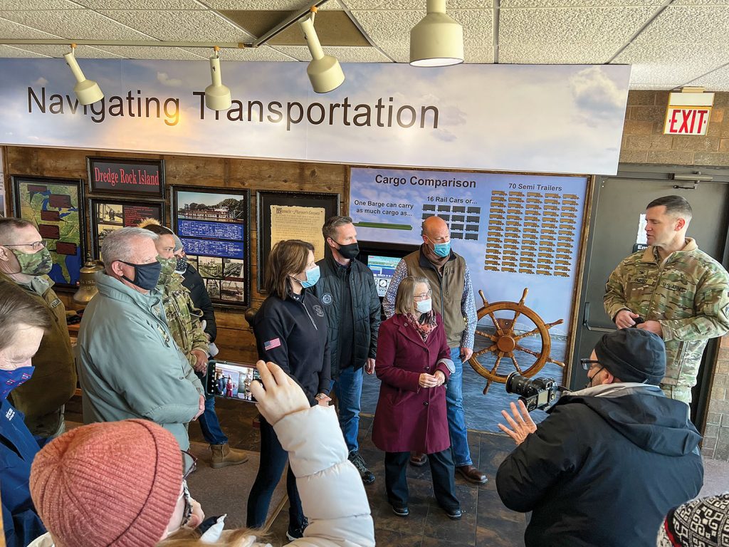 Rock Island Engineer District Commander Jess Curry, right, describes the function of the lock and dam system and the rehabilitation project at L&D 15. (Photo by Paul Rohde)