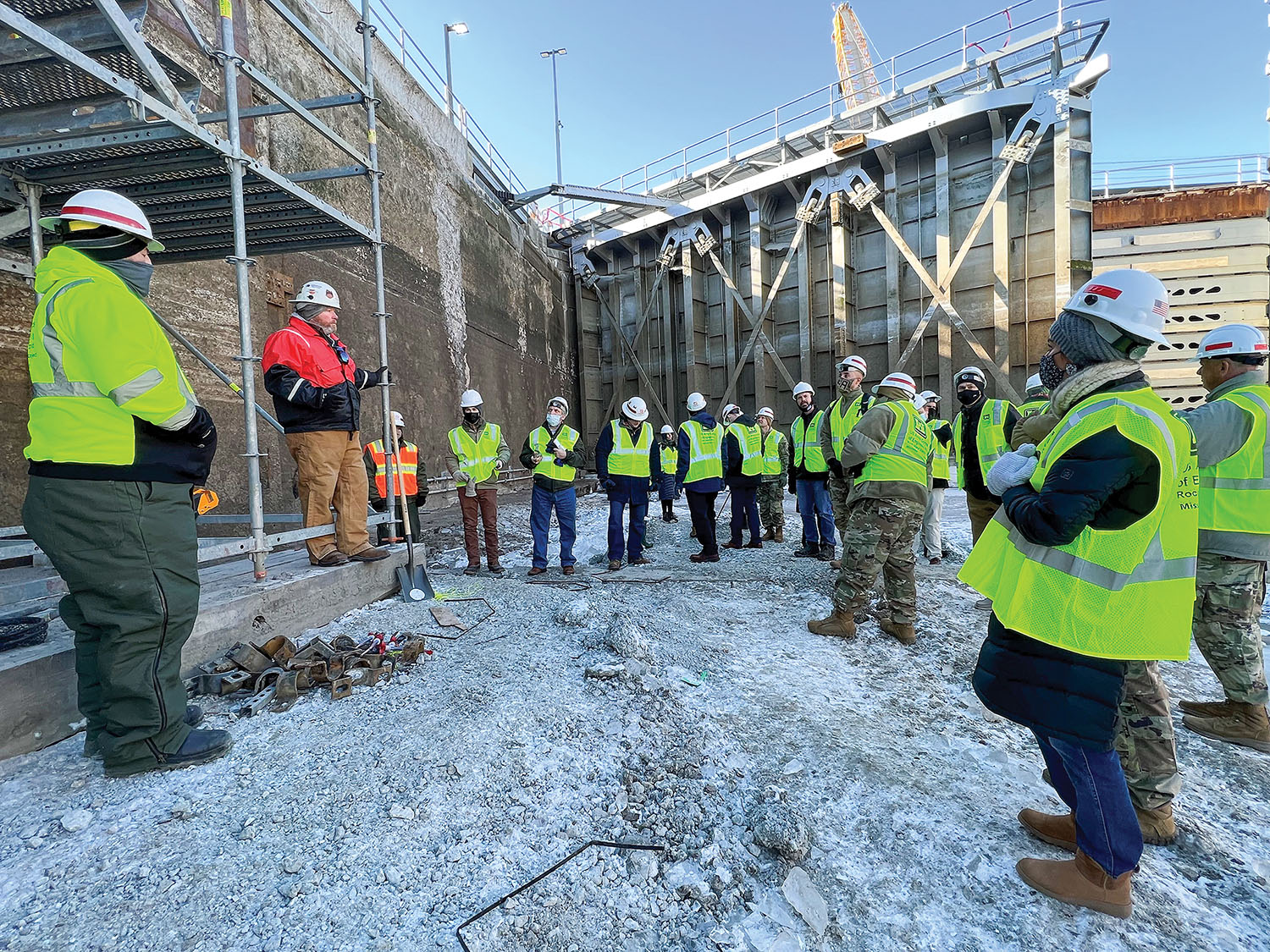 Elected representatives, Corps officials, media and guests stand on the bottom of Lock 15 during a tour January 26. (Photo by Paul Rohde)