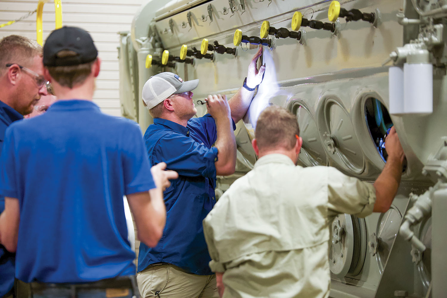 Students study a diesel engine as part of a 28-day marine engineering “boot camp” offered by West Kentucky Community & Technical College. The college was designated as a U.S. Maritime Center of Excellence for Domestic Maritime Workforce Training and Education in 2021, the only such designation of 27 centers nationwide specifically for brown-water mariners. (photo courtesy of West Kentucky Community & Technical College)