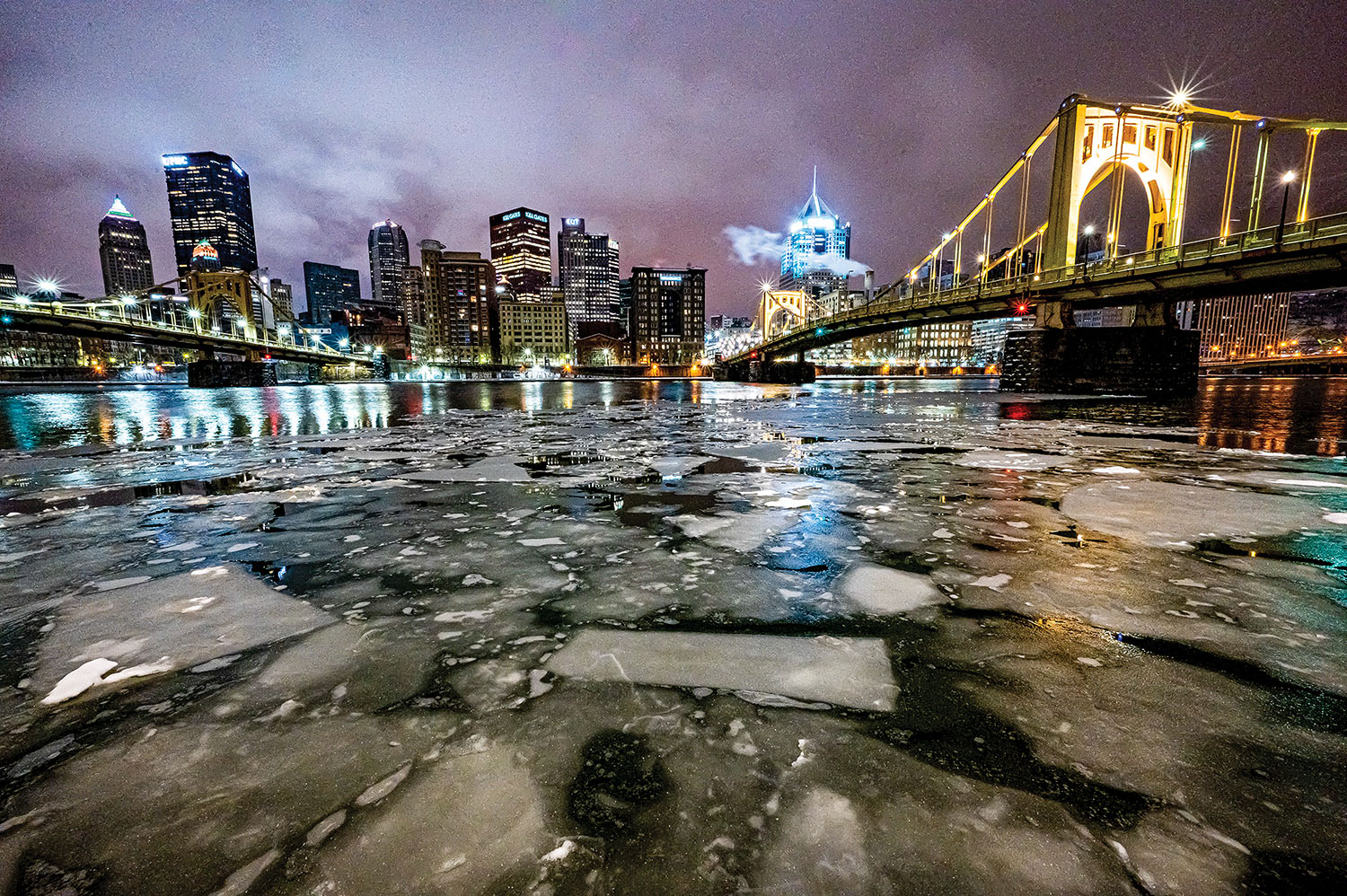 Ice forms on the Allegheny River in Pittsburgh, Pa., on January 25. Ice is a recurring concern in the winter for industries that rely on navigation to transport commodities. To get ahead of navigation impacts, the Ice Hydro Committee is composed of members from the Coast Guard, Corps of Engineers, National Weather Service, the Waterways Association of Pittsburgh and other stakeholders. (Photo by Michel Sauret/Pittsburgh Engineer District)