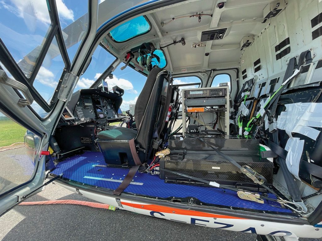 Right: Monitoring equipment in helicopter cockpit. (Photo courtesy of Vicksburg Engineer District)