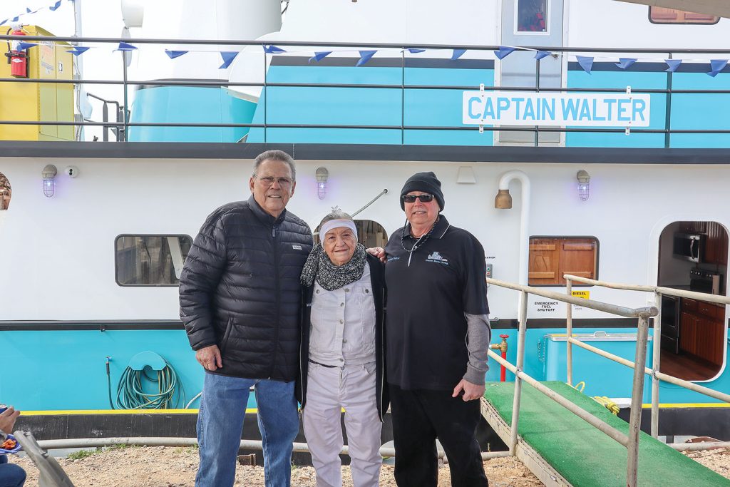 Capt. Walter O’Connor, right, stands with his mother and Corbert Plaisance, owner of Crescent Marine. (Photo courtesy of Crescent Marine Towing)