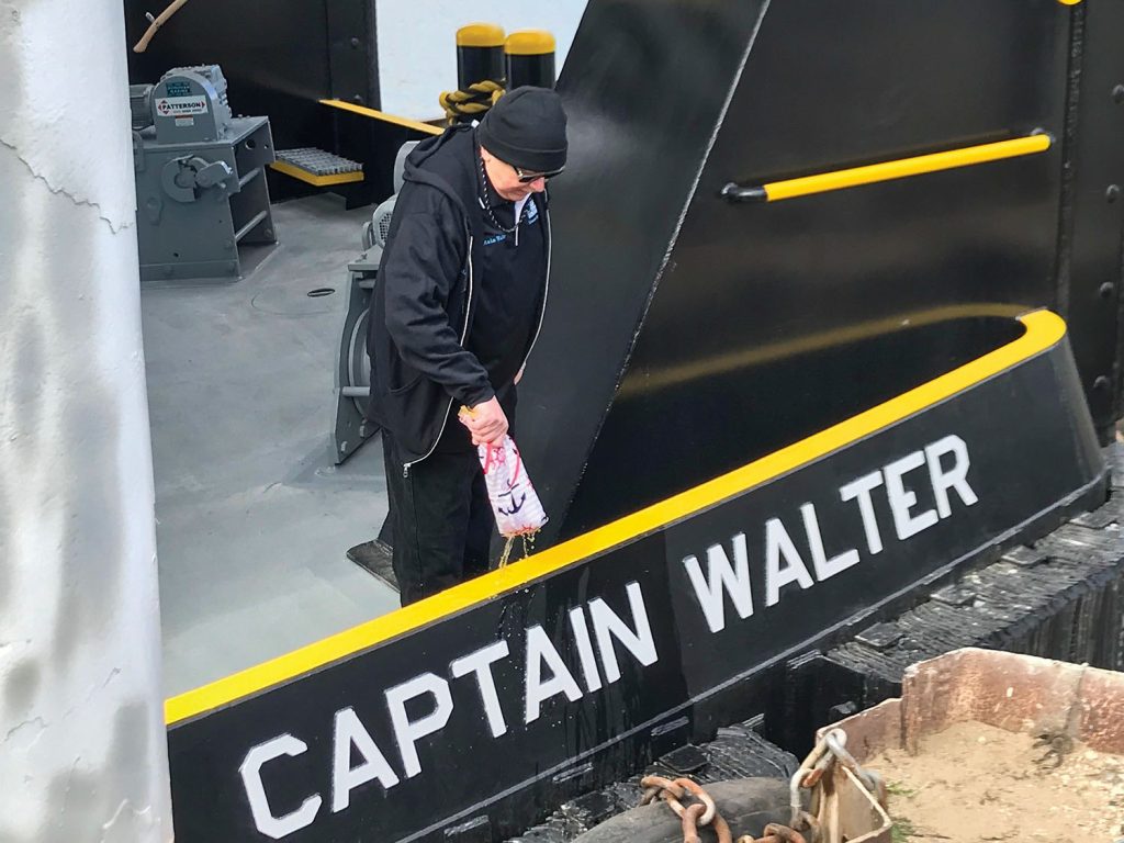 Capt. Walter O’Connor christens his namesake vessel. (Photo courtesy of Crescent Marine Towing)