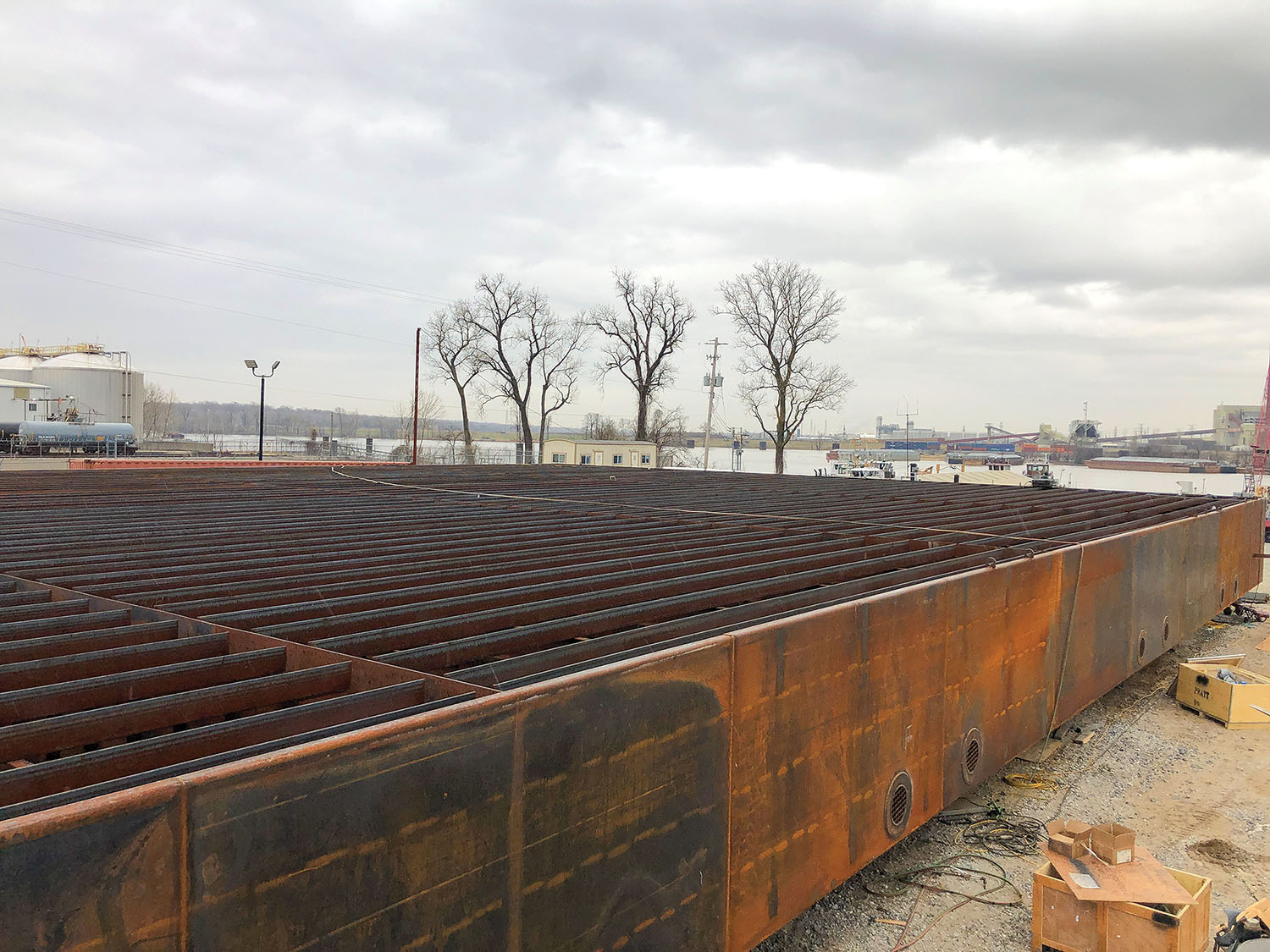 This photo shows the 120- by 80- by 7-foot pontoon for the 1,300-ton drydock that is under construction at Wepfer’s Memphis shipyard.