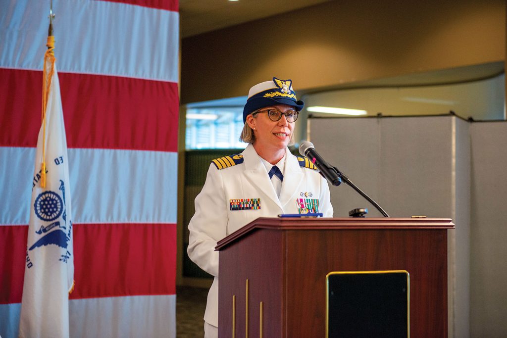 Above right: Capt. Kelly Denning addresses the audience prior to accepting command of Sector New Orleans. (U.S. Coast Guard photo by PA3 Riley Perkofski)