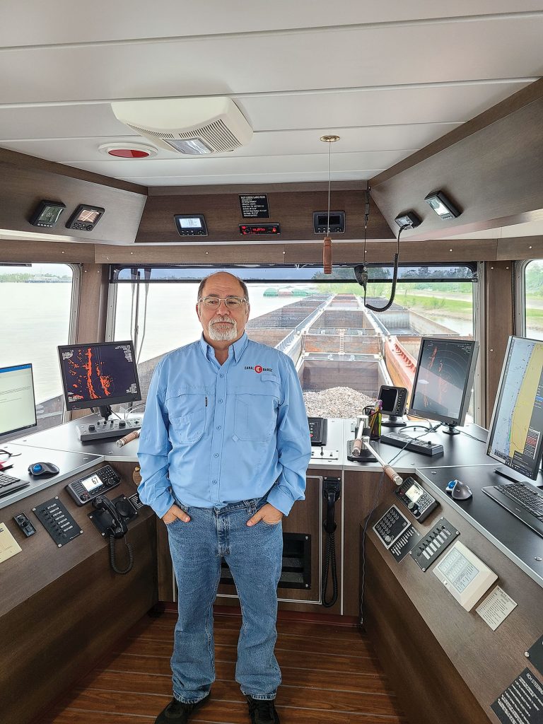 Capt. James Pruitt in the wheelhouse. (Photo courtesy of Canal Barge Company)