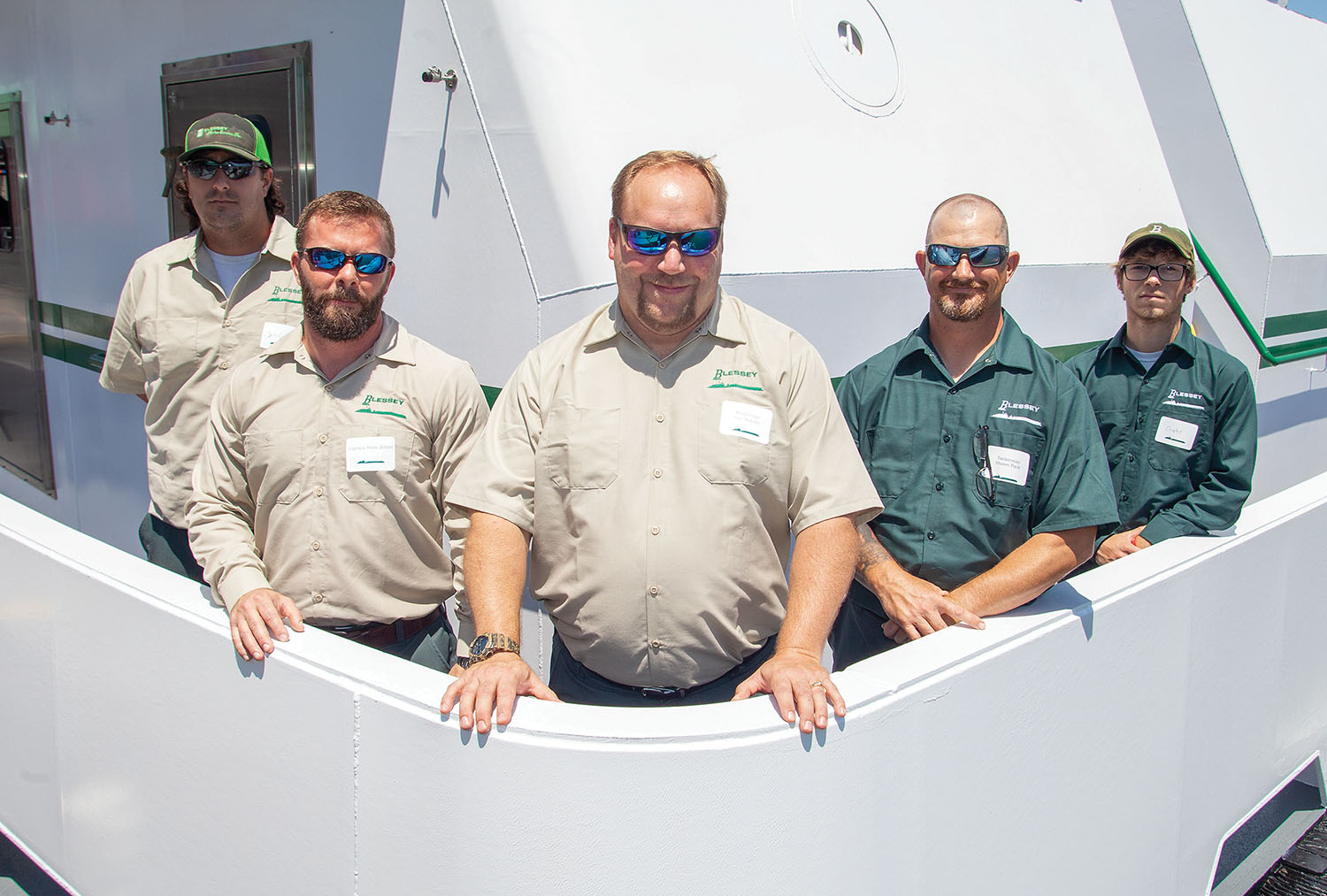 Crew of the Walter E. Blessey, Jr., from left: deckhand Caleb Richburg, Capt. Terry Zirlott, relief Capt. Eric Rabren, tankerman Shawn Pack and deckhand Gabe Brasseaux. (Photo by Frank McCormack)