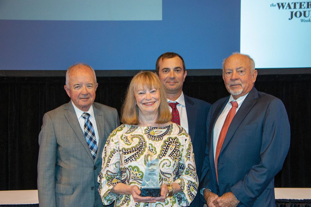 Cherrie Felder, vice president of Channel Shipyard, was honored with the IMX Achievement Award during the closing award ceremony of the 2022 Inland Marine Expo. Shown with Felder are Frank Morton, founder of Turn Services, who nominated her for the award; Jess Steger, vice president of Channel Shipyard, and Dennis Steger, president of Channel Shipyard. (Photo by John Shoulberg)