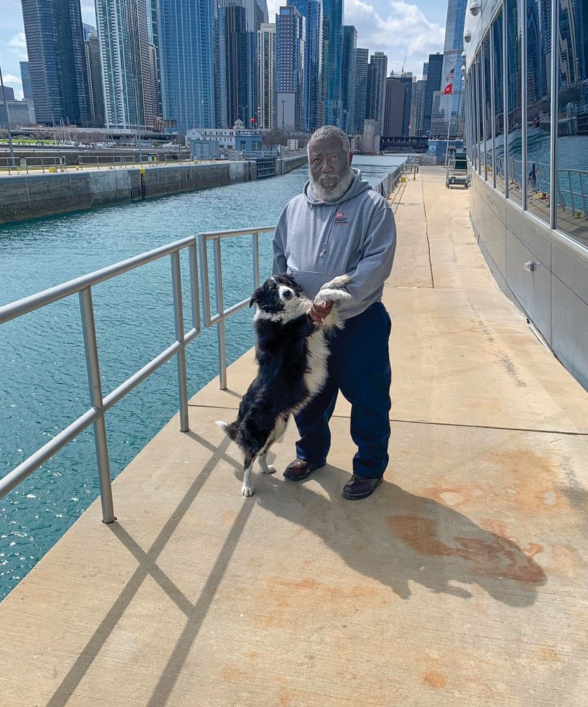 Lockmaster Tyrone Valley with Ellie at Chicago Harbor Lock. (Photo courtesy of Chicago Engineer District)
