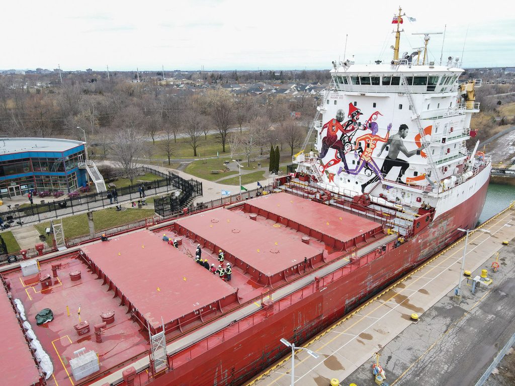 The 64th navigation season of the St. Lawrence Seaway officially launched with an opening ceremony on March 24. Canada Steamship Lines’ Welland, a Trillium Class bulk carrier, was the first ship to pass through the Eisenhower Lock in Massena, N.Y., on March 22, marking the opening of the Montreal-Lake Ontario Section of the St. Lawrence Seaway. The ship was painted with a mural depicting four stylized runners, celebrating the upcoming Canada Summer Games. The mural was unveiled as part of the ceremony in St. Catherines, Ontario.