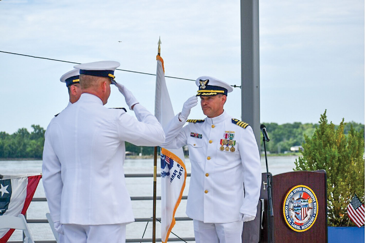 Capt. Andrew Bender (right) relieves Captain Richard “Mick” Scott (left) as Sector Upper Mississippi River commander. (Photo courtesy of Coast Guard Sector Upper Mississippi River)
