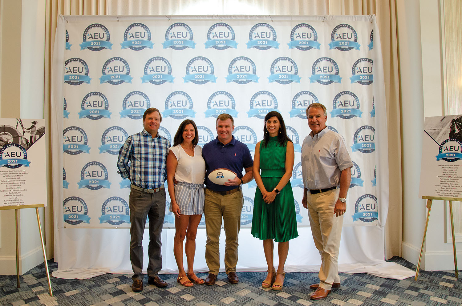 Katie and David Freeman (center) receiving American Equity Underwriters safety award.