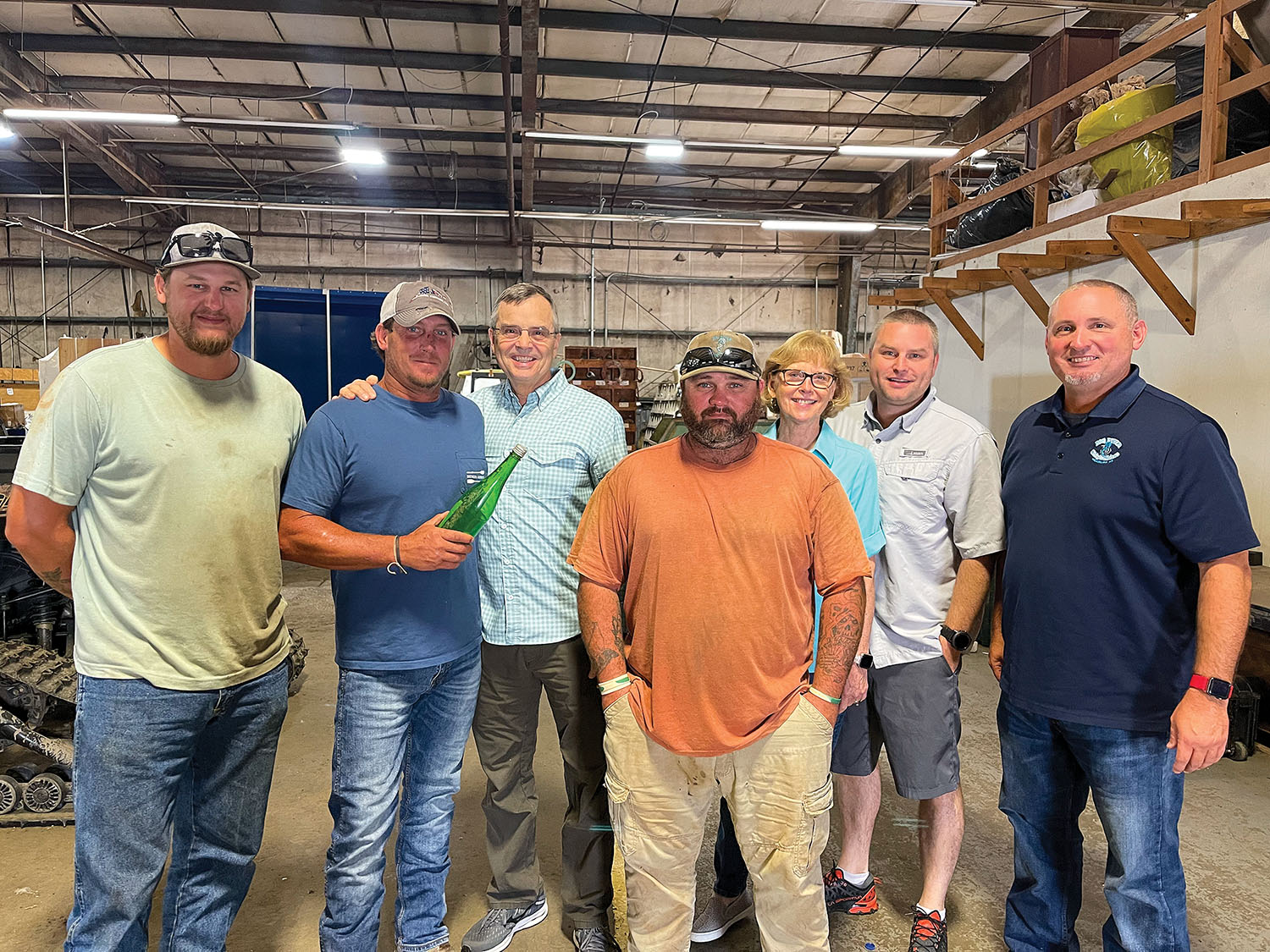 Dahl family members visit with Big River Shipbuilders team members; from left are: Turner Williams, Billy Mitchell, Eric Dahl, T.J. Smith, Melanie Dahl, Chris Dahl and Brad Babb. (Photo courtesy of Eric Dahl)