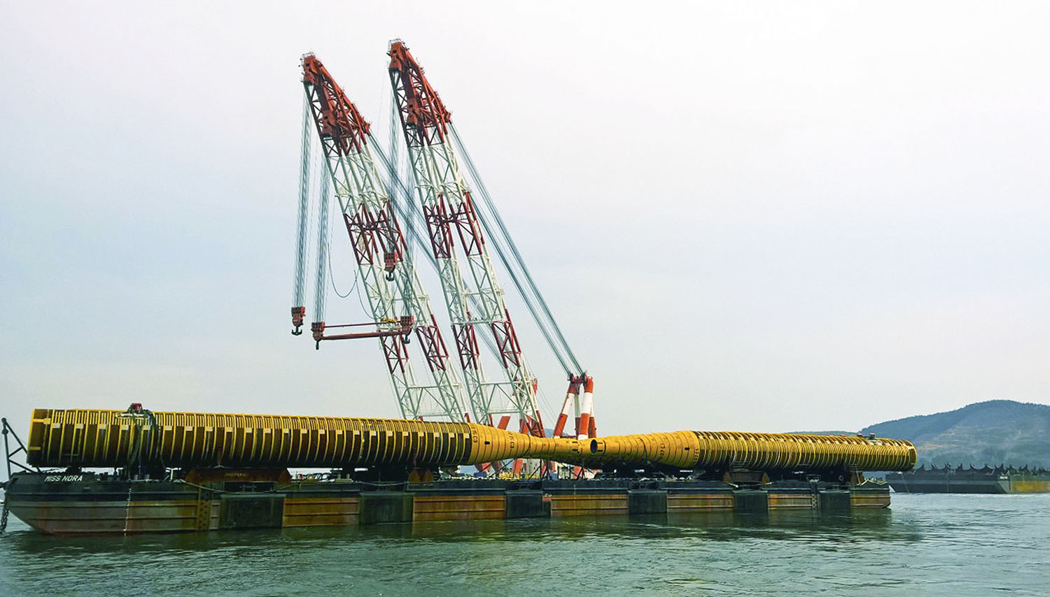 Cashman Equipment Corporation barge Miss Nora at work.