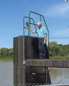 Robert Wilkins christens his namesake boat. (Photo by David Murray)