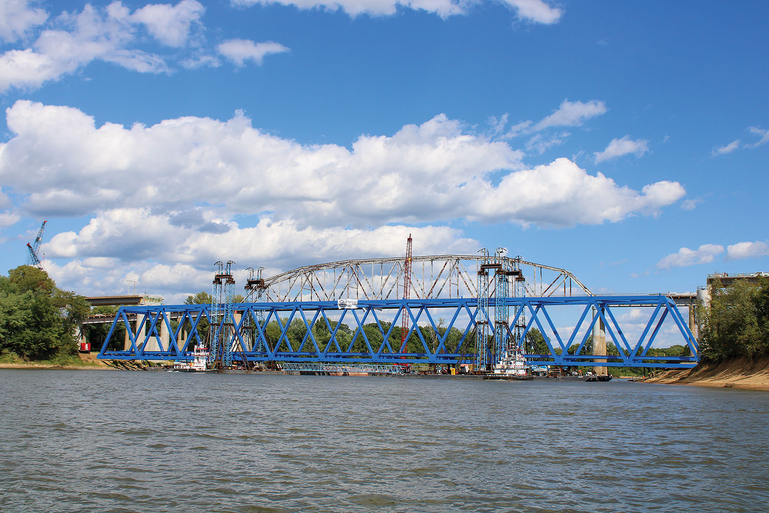 Excell Marine towboats took the 700-foot steel truss that is the main span for the new Cumberland River bridge at Smithland down the Tennessee River from Paducah, then up the Ohio River to the Cumberland River at Smithland. It was floated on four jumbo barges. (Photo by Shelley Byrne)