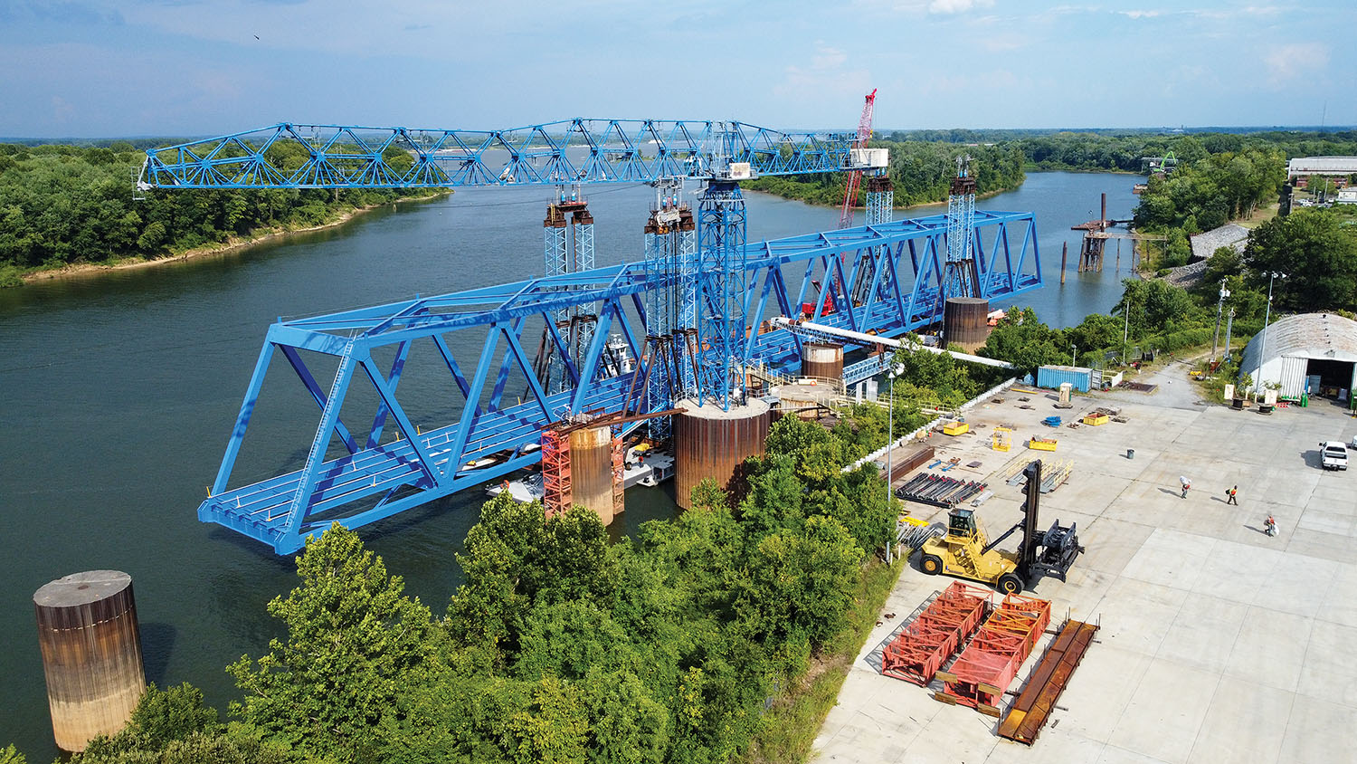 The 700-foot steel truss that comprises the main span of the new U.S. 60 bridge over the Cumberland River will be floated and lifted into place later in September. The work will cause brief closures of portions of the Tennessee and Ohio rivers and a closure of up to three days at the new bridge’s site. (Photo courtesy of American Bridge Company)