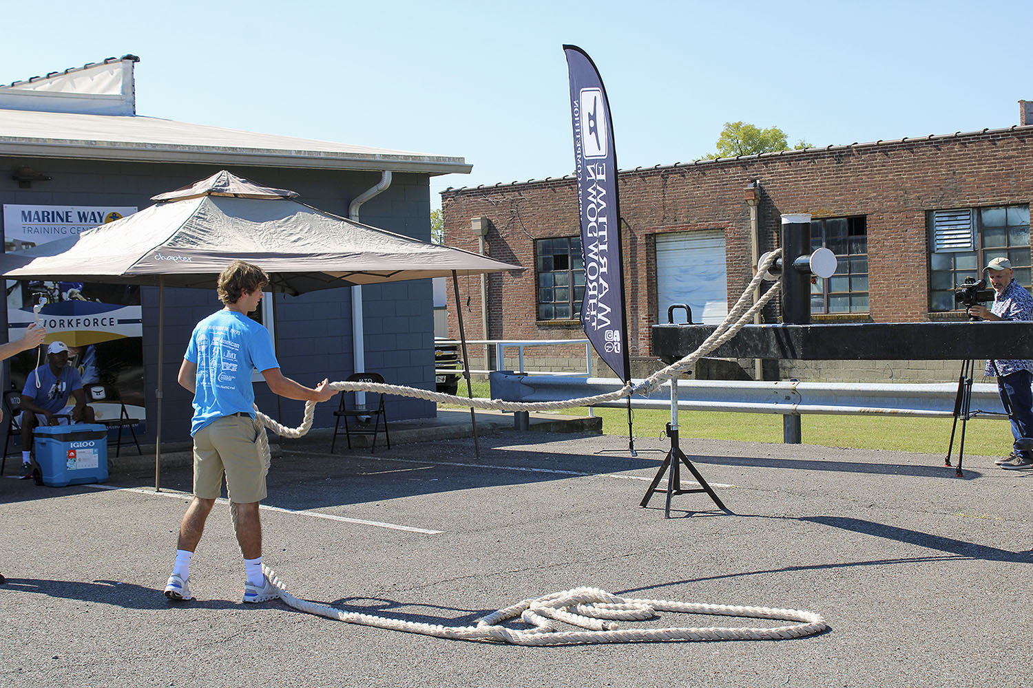 A St. Mary High School student practices throwing a line as part of a station sponsored by Maritime Throwdown. (Photo by Shelley Byrne)