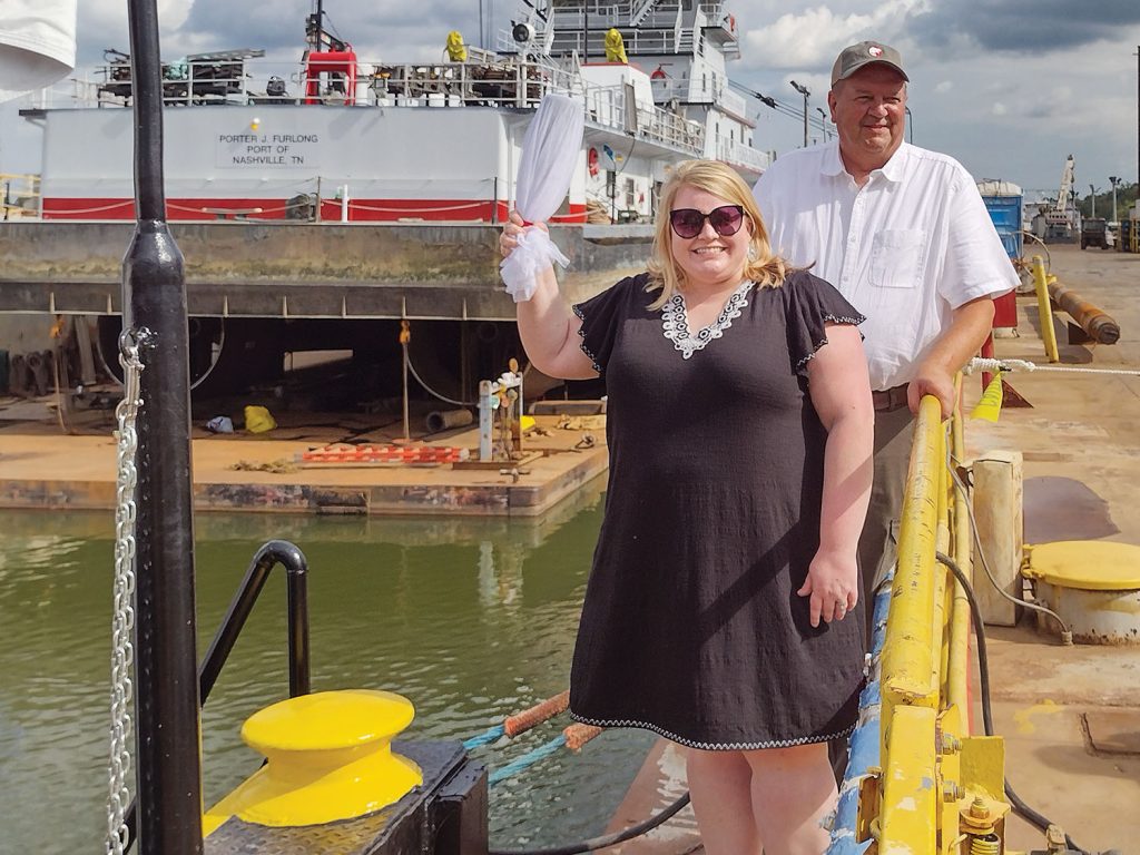 Mary Beth Salyers prepares to christen the mv. Capt. Larry Salyers while her husband, the vessel’s namesake, looks on. (Photo by Shelley Byrne)