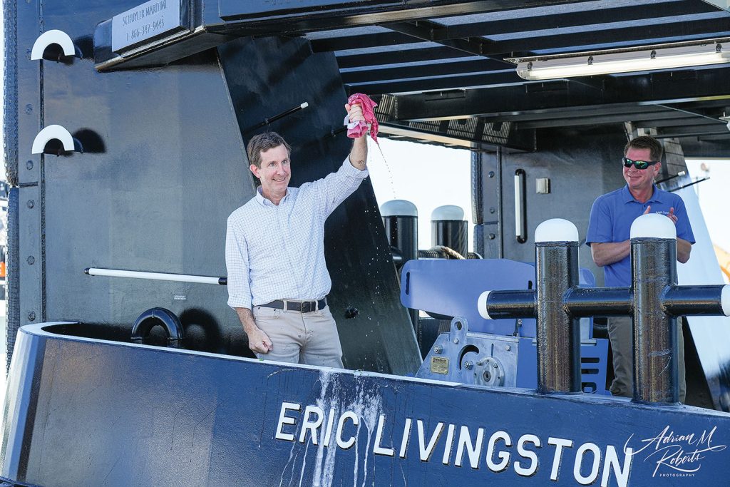 Eric Livingston christens namesake vessel. (Photo by Adrian M. Roberts, courtesy of Steiner Construction)