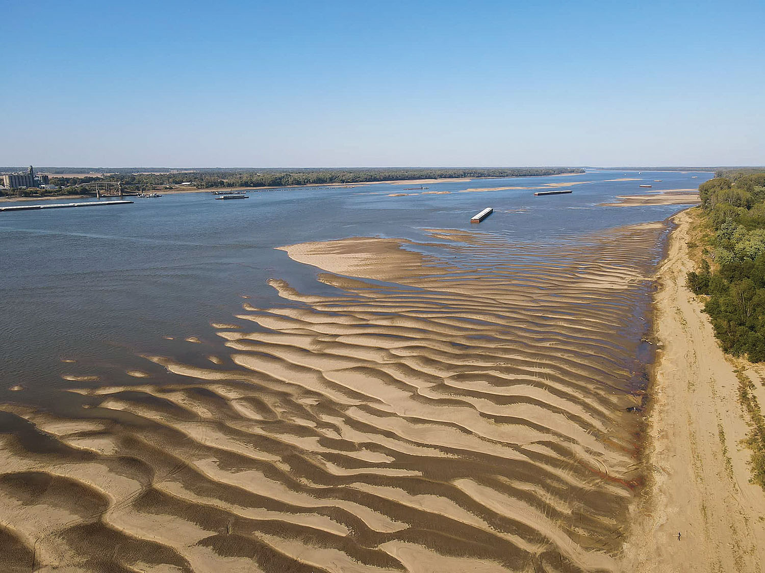 A drone photo shows low-water conditions at Ohio River Mile 974 near Mound City, Ill., including some of the barges that had grounded in the area recently. (Photo by Zoe Dillworth)