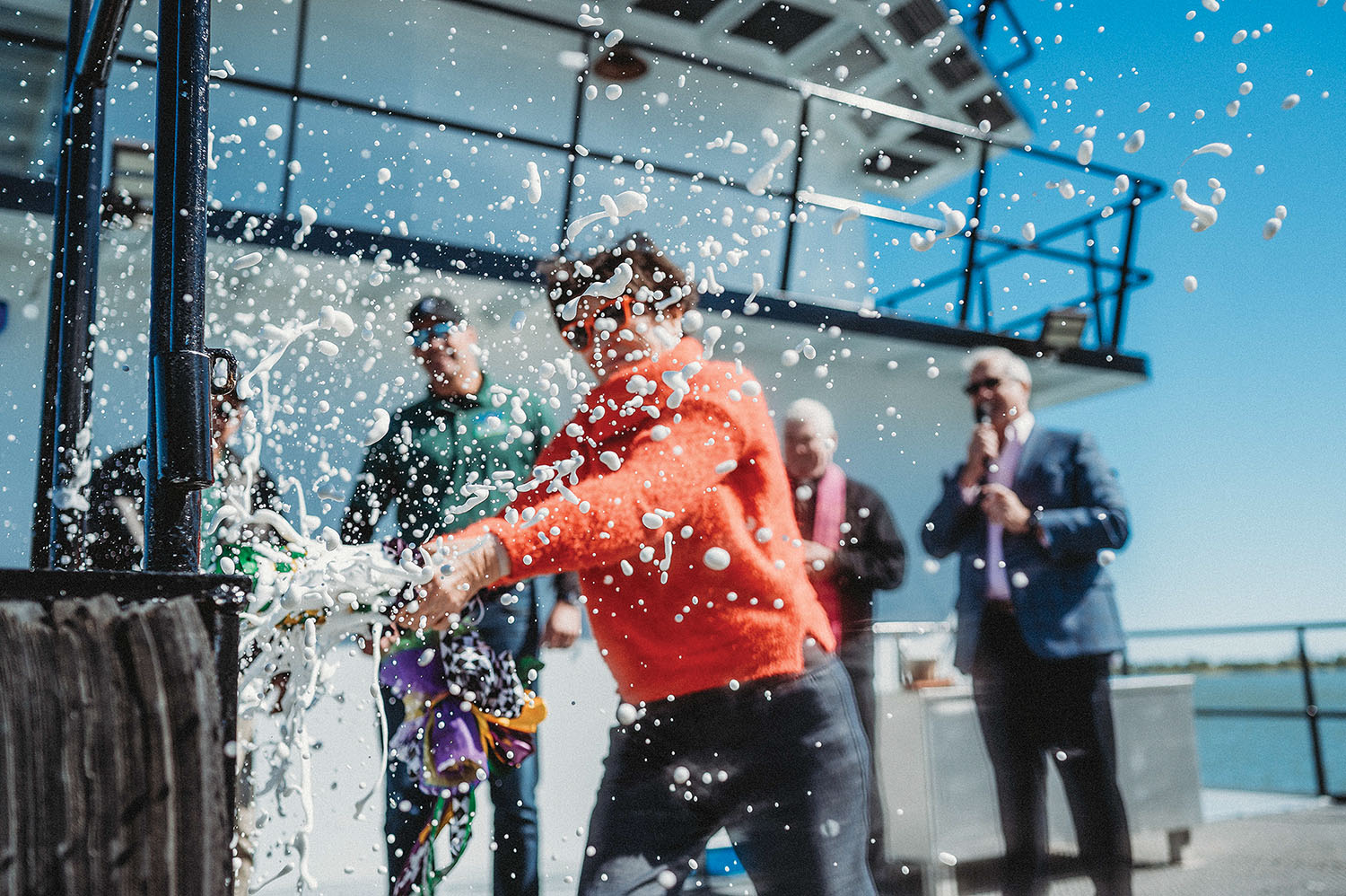 Amelia Leonardi breaks champagne bottle to christen the mv. Jacques-Imo. (Photo by Katie Sikora courtesy of Buffalo Marine)