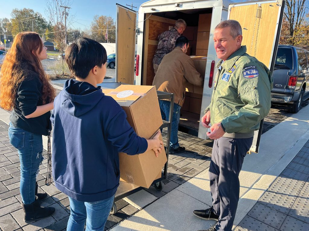 Paducah Tilghman High School Navy Junior ROTC students pack boxes for the Christmas on the River portion of Seamen’s Church Institute’s Christmas at Sea program and load them into a trailer for later distribution to towboat companies. (Photo by Bonny Shirk)