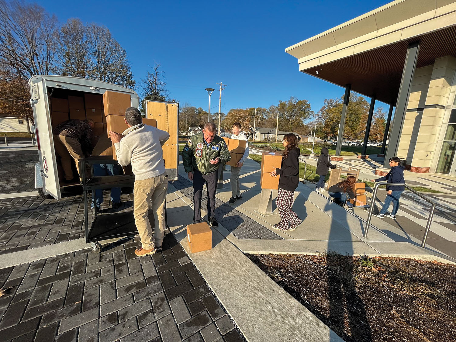 Paducah Tilghman High School Navy Junior ROTC students pack boxes for the Christmas on the River portion of Seamen’s Church Institute’s Christmas at Sea program and load them into a trailer for later distribution to towboat companies. (Photo by Bonny Shirk)