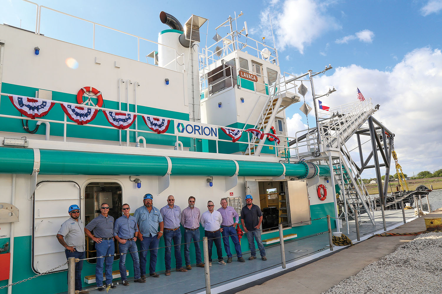 Crew members and officials aboard the Orion Marine Group dredge Lavaca. (Photo courtesy of Orion Marine Group)