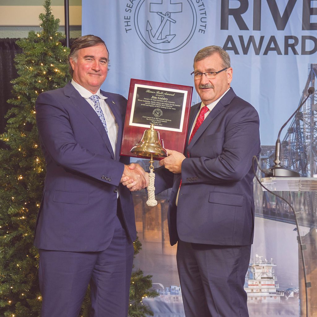 Christian O’Neil, President of Kirby Inland & Offshore Marine, left, presents the River Bell Award to Jim Guidry, executive vice president-vessel operations, Kirby Inland & Offshore Marine. (Photo by Brad Rankin, courtesy of Seamen's Church Institute)