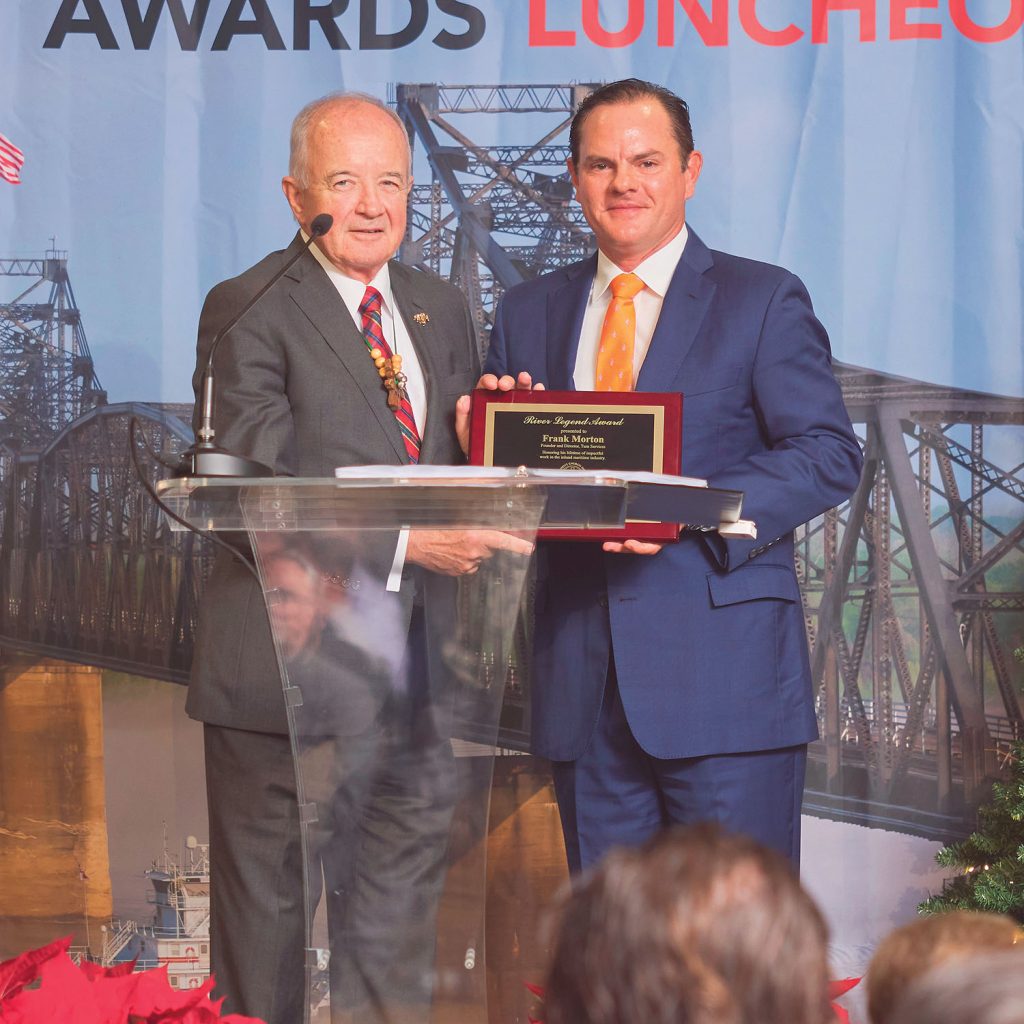 Mario Muñoz (right), president of Turn Services, presents the River Legend Award to Frank Morton, director of Turn Services. (Photo by Brad Rankin, courtesy of Seamen's Church Institute)