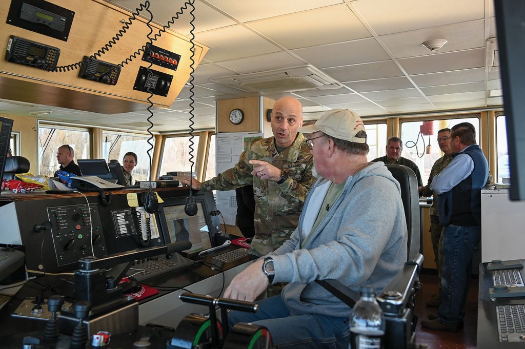 Lt. Gen. Scott Spellmon talks with Second Mate Jeff Dunman, who’s piloting the Potter and coordinating with towboat traffic. (Corps of Engineers photo by George Stringham)