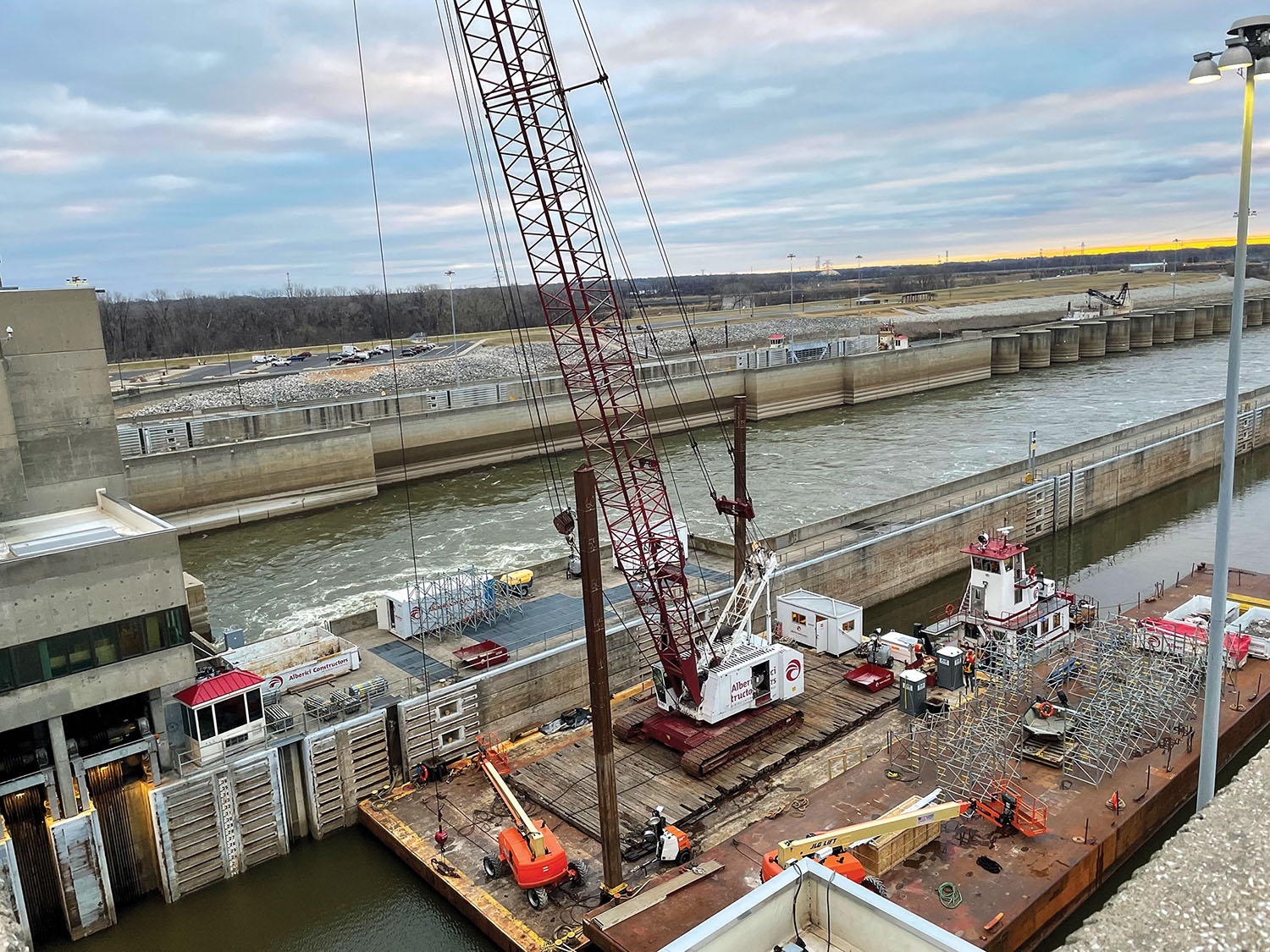 Barge equipment is positioned for work on the overlook structure at Mel Price Lock and Dam near St. Louis. Alberici Constructors team members will remove and replace two overlook structures so that the lift gates at Mel Price can be replaced sometime next year. (Photo courtesy of Alberici Constructors Inc.)