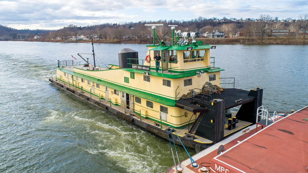 The Capt. Rick Neale northbound at Ohio River Mile 172, December 29, 2022, with Capt. Rick Neale outside the pilothouse. (Capt. C.R. Neale photo)