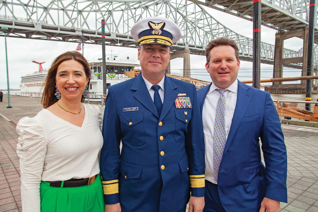 Rear Adm. Richard Timme (middle) stands alongside Clark Todd, president and CEO of Blessey Marine Services, and Angie Fay, vice president of HSE and compliance at Blessey, February 20, Lundi Gras, dockside at the Port of New Orleans. (Photo by Frank McCormack)