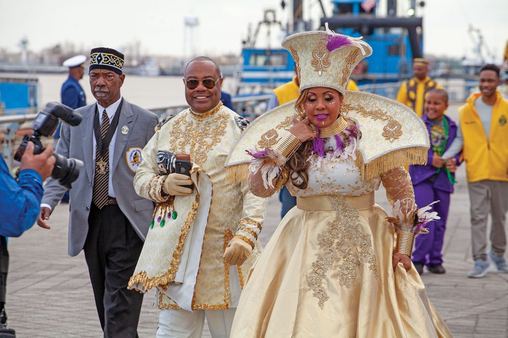 Randolph "Rudy" Davis, the 2023 king of the Zulu Social Aid & Pleasure Club, and Crystall Guillemet, this year's queen, prepare to board the U.S. Coast Guard Cutter Pamlico at the Port of New Orleans February 20. The Pamlico delivered the courts of both Zulu and the Rex Organization to Spanish Plaza, an annual Carnival tradition in New Orleans. (Photo by Frank McCormack)