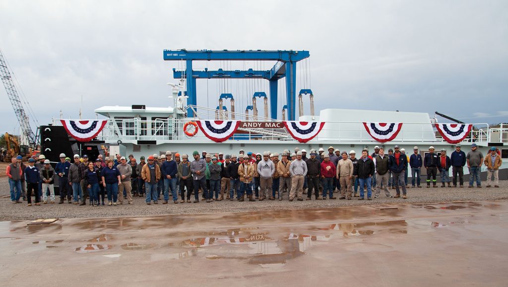 Steiner Construction workers pose in front of the completed mv. Andy Mac. (Photo by Frank McCormack)