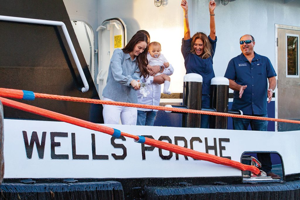 Danae Porche christens the mv. Wells Porche. (Photo by Frank McCormack)